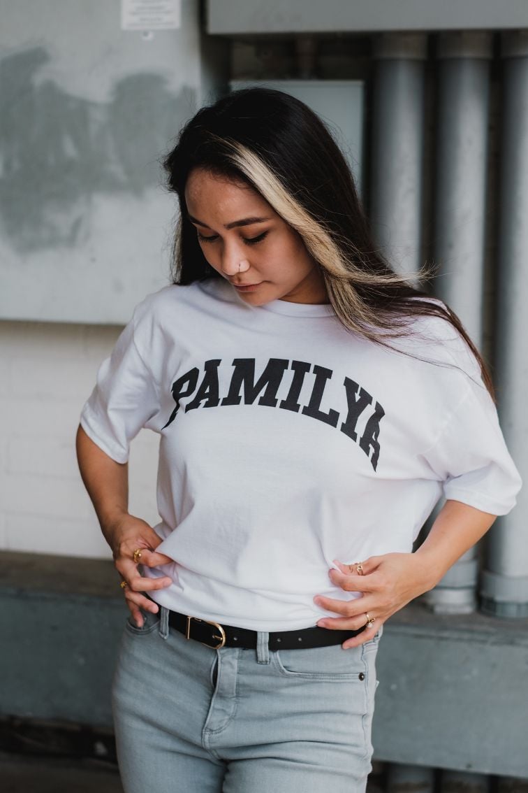 Woman looking at her uniquely designed t-shirt